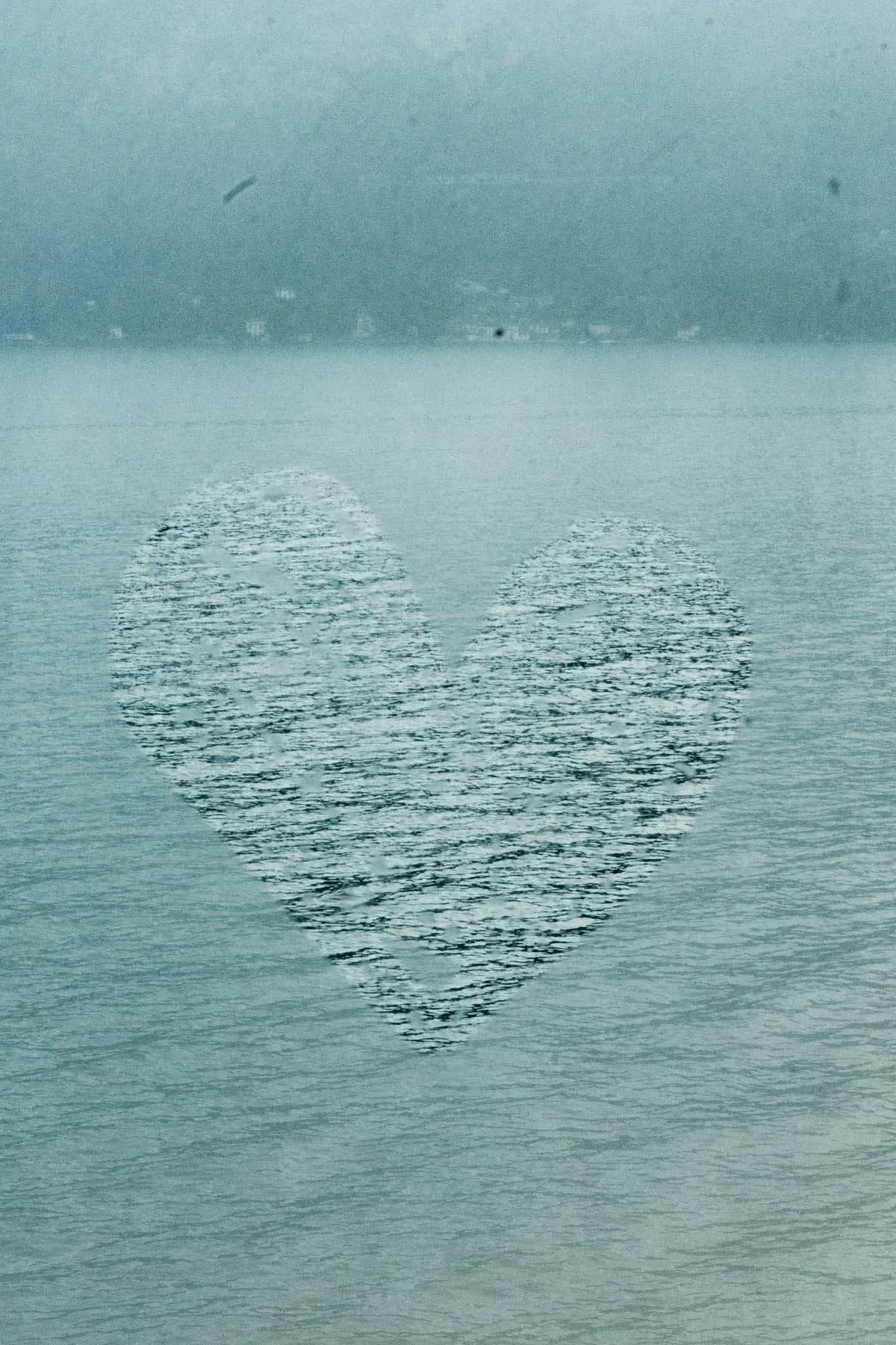 Heart-shaped reflection on water