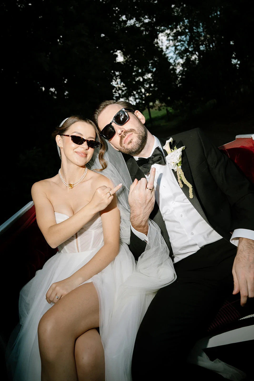 Bride and groom wearing sunglasses