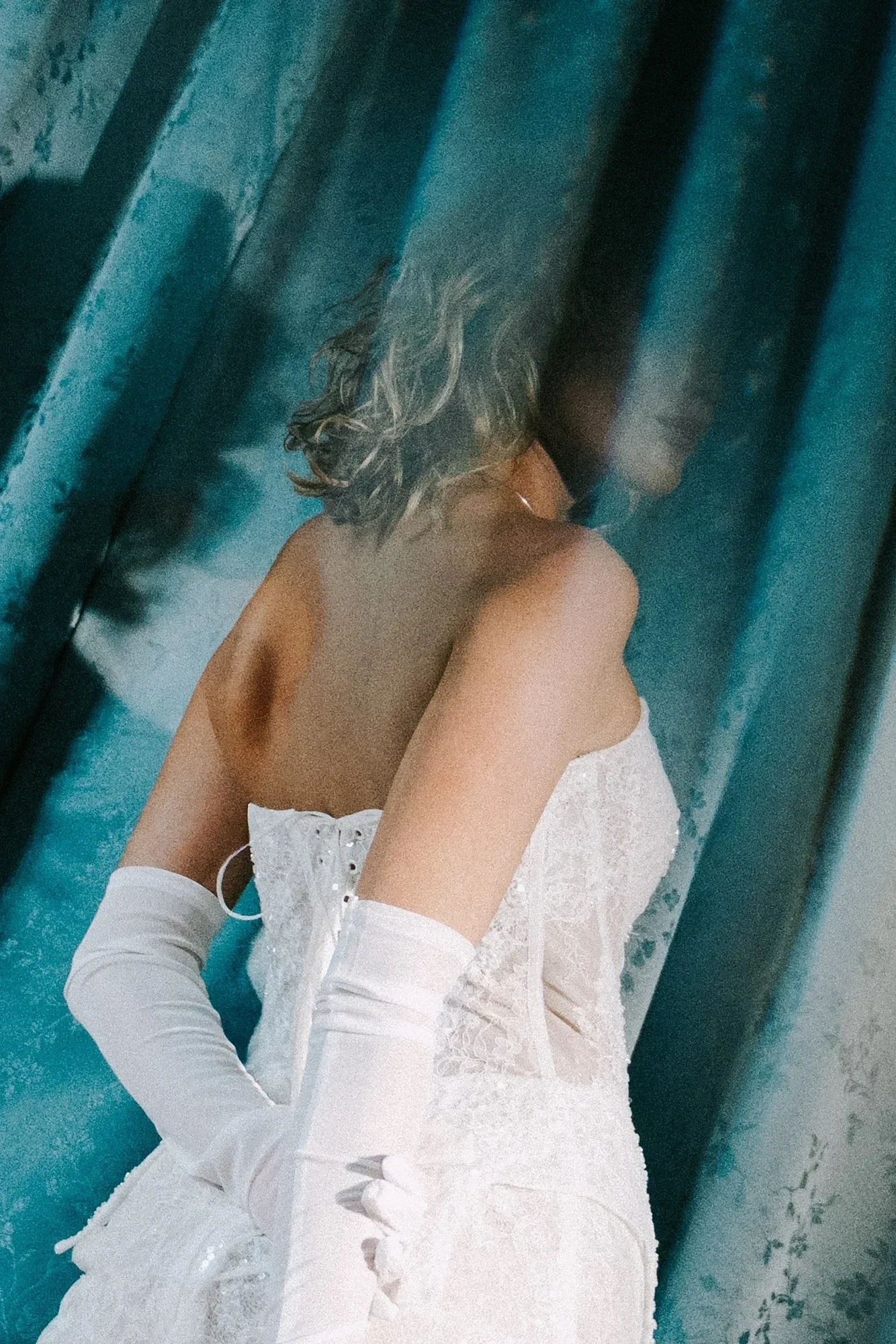 Bridal portrait showing an open-back dress