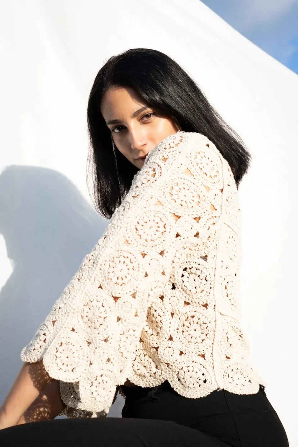 Woman looking up at the camera against a white background
